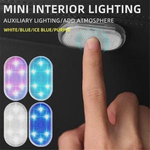 May include: Mini interior lighting auxiliary lighting add atmosphere white blue ice blue purple. Oval-shaped LED light with a textured surface. The device is shown in four color variations including purple, light blue, white, and blue.