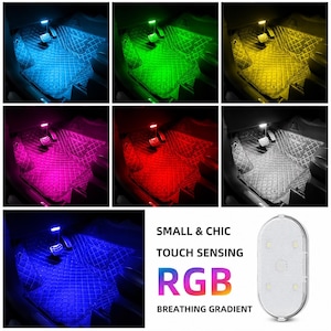 May include: An oval-shaped touch-sensing RGB LED light for vehicle interiors. The light features a white textured surface and emits various colors including blue, green, yellow, pink, red, and white. Text reads: SMALL & CHIC TOUCH SENSING RGB BREATHING GRADIENT.