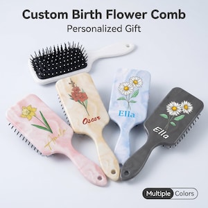 May include: Five rectangular hair brushes with black bristles. One is plain white. Four feature marble-like patterns in pink, beige, blue, and dark gray, each decorated with a floral illustration and a name: Amela, Oscar, or Ella. Text reads: Custom Birth Flower Comb, Personalized Gift, Multiple Colors.