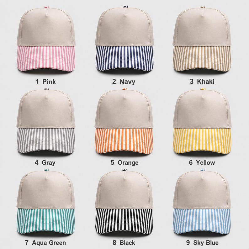 May include: Nine baseball caps arranged in a grid, each featuring a solid beige crown and a striped brim. The brims come in pink, navy, khaki, gray, orange, yellow, aqua green, black, and sky blue. Each cap is labeled with a number and color name.