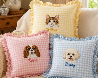 May include: Three square throw pillows with ruffled edges and gingham patterns in yellow, pink, and blue. Each pillow features an embroidered pet portrait and a name: a cat named Willow, a spaniel named Rosie, and a poodle named Benny.