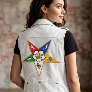 May include: A white leather vest featuring a large, multi-colored embroidered star emblem on the back. The star contains five distinct points in red, blue, green, yellow, and white, each with a unique symbol. The center of the star displays the letters F, A, T, H, and A.