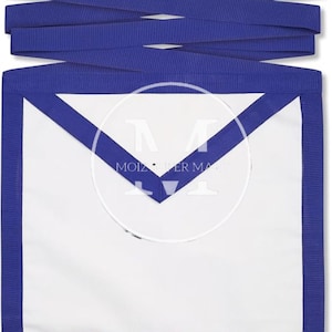 May include: A white ceremonial apron featuring a blue border and a triangular flap, accented with long blue fabric ties at the top. The center of the apron displays a faint, circular watermark containing the text MOIZ SUPER MART.