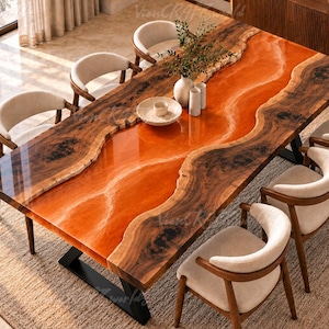 May include: A rectangular dining table featuring two natural live-edge wood slabs joined by a central, glossy, translucent orange resin river. The table is supported by black metal legs and is surrounded by six curved, cream-colored chairs.