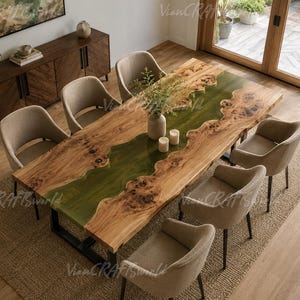 May include: A rectangular dining table featuring a natural live-edge wood slab with a translucent green resin river inlay down the center, supported by black metal legs, surrounded by six beige upholstered chairs with curved backrests.