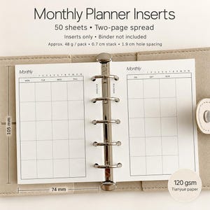 May include: Monthly planner inserts featuring a two-page spread with 50 sheets. The white paper has black grid lines, 105 mm by 74 mm dimensions, 1.9 cm hole spacing, and 120 gsm weight. The inserts are held by a silver metal ring mechanism.