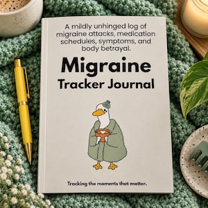 May include: A white Migraine Tracker Journal with black text that reads: A mildly unhinged log of migraine attacks, medication schedules, symptoms, and body betrayal. Migraine Tracker Journal. Tracking the moments that matter. Features a cartoon duck.