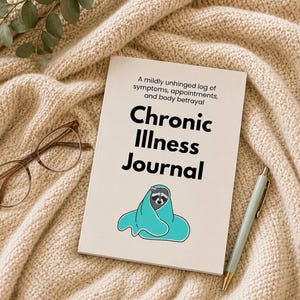 May include: A white journal with the text A mildly unhinged log of symptoms, appointments, and body betrayal and Chronic Illness Journal, featuring a graphic of a raccoon wrapped in a teal blanket, accompanied by brown glasses and a light blue pen.