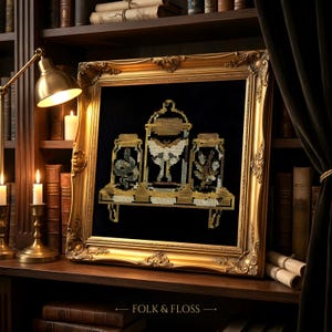 May include: A framed cross-stitch embroidery on black fabric featuring three glass cloches on a shelf. The center cloche contains a large moth, while the side cloches hold a snake and a plant. The text FOLK & FLOSS is printed at the bottom.
