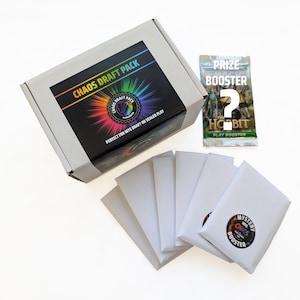 May include: A white cardboard box labeled Chaos Draft Pack with a rainbow burst graphic, accompanied by five plain white envelopes and one sealed Magic The Gathering The Hobbit play booster pack with a large white question mark overlay.