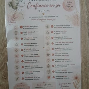 Peut inclure: Une affiche blanche intitulée AFFIRMATIONS Confiance en soi FÉMININE avec un dessin au trait d'une personne, des motifs floraux et une liste numérotée de vingt affirmations en français avec des icônes, imprimée en rose et marron.