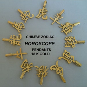 May include: Twelve gold pendants featuring the Chinese zodiac animal symbols. The pendants are arranged in a circle and labeled "CHINESE ZODIAC HOROSCOPE PENDANTS 18 K GOLD".