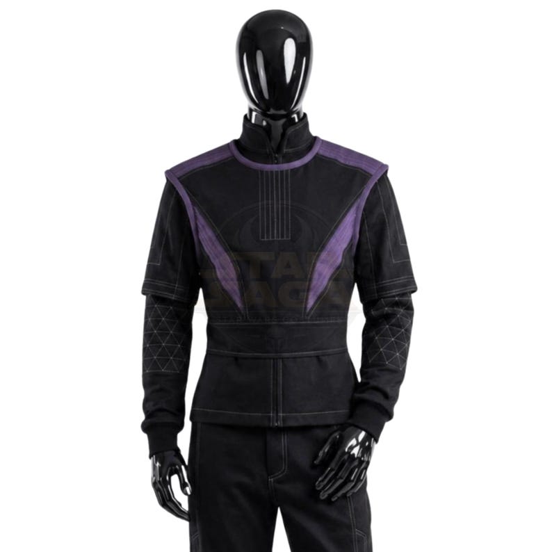 May include: A black long-sleeved jacket with a high collar and a front zipper closure. The garment features purple panels on the shoulders and chest, with a geometric triangle pattern stitched onto the lower sleeves and visible white stitching.