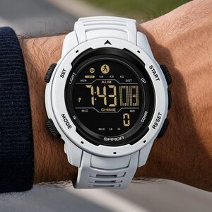 May include: A white digital sports watch with a black circular face and a textured white silicone strap. The display shows the time 7:43, the text SAMOA, ALM, CHIME, and various icons including a runner. It features side buttons labeled SET, LIGHT, START, UP, DOWN, RESET, and MODE.