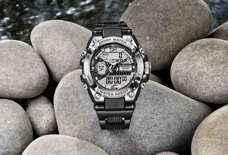 May include: A black and silver analog-digital sport watch with a metallic bezel, black resin strap, and a multi-functional dial. The watch face features the text SPORT WATCH, LIGE, and WATER RESIST, with digital displays and luminous hands.