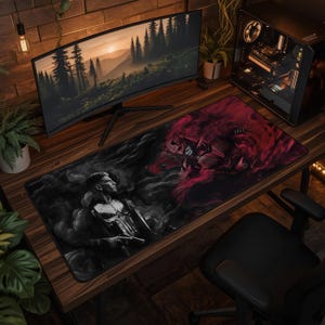 May include: A rectangular desk mat featuring a split-design graphic. The left side displays a grayscale image of a character with a skull emblem on their chest, while the right side shows a red-toned, smoky illustration of a masked figure.