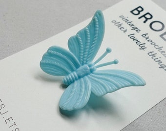 Blauwe vlinderbroche, plastic pin