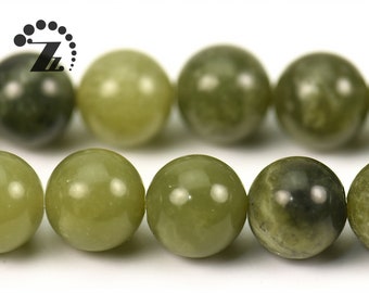 May include: A strand of round, green jade beads. The beads have a mottled, natural appearance.