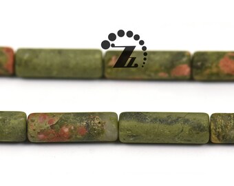 May include: A strand of green, brown, and pink jasper beads. The beads are cylindrical and have a natural, polished finish.