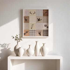 May include: A square wall art print featuring a grid of sixteen panels in shades of beige, brown, and white. The panels display alternating patterns of plaid and gingham alongside silhouettes of deer antlers, a deer, a duck, reeds, and tracks.