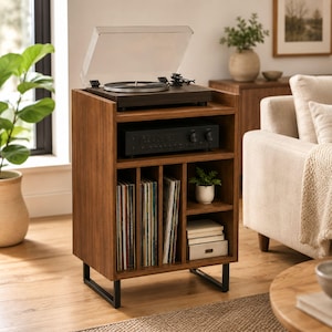 May include: A wooden record player stand with a dark brown finish and black metal legs. The top surface holds a turntable with a clear dust cover. Below, an open shelf houses an audio receiver, while the bottom section features vertical dividers for vinyl records and two small shelves for storage.