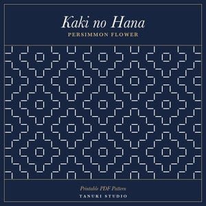 May include: A printable PDF pattern titled Kaki no Hana Persimmon Flower by Tanuki Studio. The design features a dark navy blue background with a repeating white geometric stitch pattern composed of small dashes forming flower-like shapes.