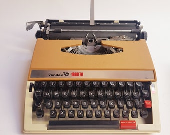 Vintage Vendex 1660 TR werkende draagbare typemachine, bruin, qwerty, jaren 60