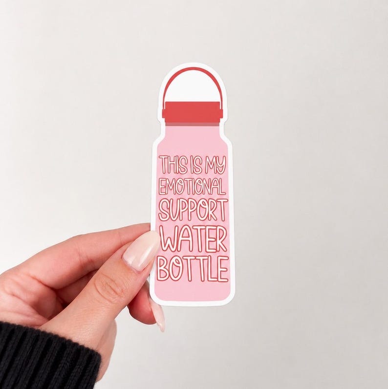 May include: A die-cut sticker shaped like a water bottle with a light pink body and a red cap. The text printed in red on the bottle reads, "THIS IS MY EMOTIONAL SUPPORT WATER BOTTLE." The sticker has a white border and a smooth, matte finish.
