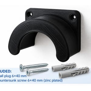 May include: A black, 3D-printed wall-mounted hook with a curved, semi-circular cradle design and two screw holes. Included are two 6x40 mm zinc-plated countersunk screws and two 6x40 mm grey plastic wall plugs for installation on a flat surface.
