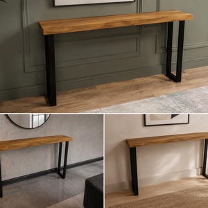 Puede incluir: Una mesa consola larga y estrecha con un tablero de madera natural con veteado visible y acabado de borde vivo. La mesa se apoya sobre dos patas de metal negro en forma de U, proporcionando una base firme a este mueble rectangular.