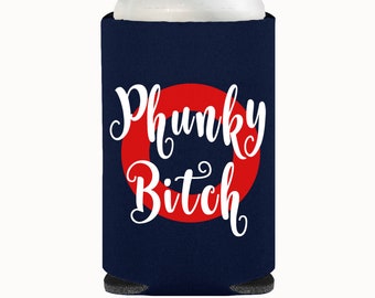 May include: Navy blue can cooler with the words "Phunky Bitch" in white script over a red circle. The cooler is designed to keep beverages cold and fits a standard-sized can.