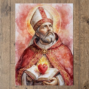 Op de afbeelding: Een aquarel van een bebaarde bisschop met een rode en gouden mijter en gewaad. De figuur houdt een open boek vast met een brandend rood hart dat door een pijl wordt doorboord op de pagina's. Een gouden aureool gloeit achter het hoofd.