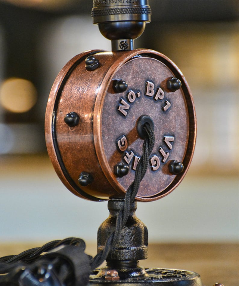 May include: A copper-colored ceiling light fixture with a black cord and a round switch that says "VTG LIFE NO. BP1".
