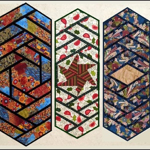May include: Three colorful table runners with geometric patterns. The first runner has a black and white geometric pattern with red, orange, and blue accents. The second runner has a green and white geometric pattern with red accents. The third runner has a blue and white geometric pattern with red, orange, and gold accents.