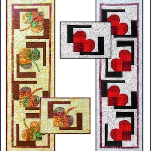 May include: Two quilted table runners with geometric designs. One features a light yellow background with brown squares and colorful leaf shapes. The other has a white background with black squares and red heart shapes. Both have a rectangular shape.