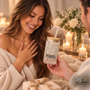 May include: A clear glass tumbler with a bamboo lid and a glass straw, featuring a light grey and white leopard print pattern. The glass is printed with the black text Delancy and the phrase my one and only in a simple sans-serif font.