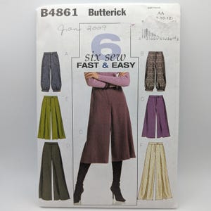 May include: Butterick sewing pattern B4861 for pants and culottes. The white envelope features the text "6 six sew FAST & EASY" and displays illustrations of six different pant styles in various colors including gray, olive, purple, and beige.