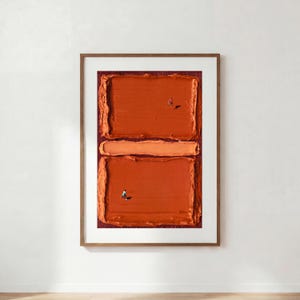 May include: A framed abstract painting featuring two large, textured rectangular blocks of burnt orange paint separated by a horizontal band of lighter orange. Two tiny, solitary figures are depicted walking across the orange surfaces.