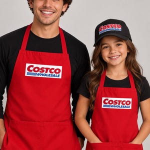 May include: Two black baseball caps and two red aprons, each featuring the Costco Wholesale logo in red, white, and blue. The aprons include a large front pocket and adjustable neck straps, while the caps have a structured crown and brim.