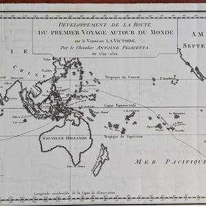 May include: A black and white historical map titled DÉVELOPPEMENT DE LA ROUTE DU PREMIER VOYAGE AUTOUR DU MONDE sur le Vaisseau LA VICTOIRE. The map displays continents, oceans, and navigational routes with French text labels across the paper surface.