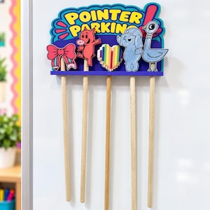 May include: A wooden pointer parking organizer with a blue base and a colorful sign reading POINTER PARKING. It features five attached character cutouts including a pink pig, a blue elephant, a pigeon, a bow, and a heart, with five wooden sticks.