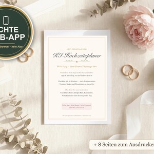 May include: A rectangular white card featuring the text "MEIN PERSÖNLICHER KJ-Hochzeitsplaner" and "Web-App - druckbares Planungs-Set" with additional German text, surrounded by two gold rings, a pink flower, and a white ribbon on a light surface.