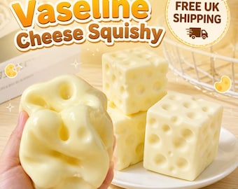 Może przedstawiać: Zabawka typu squishy w kształcie bloku szwajcarskiego sera z dziurami, w kolorze złamanej bieli. Tekst Vaseline Cheese Squishy jest wyraźnie widoczny nad obiektami, wraz z okrągłą grafiką zawierającą napis FREE UK SHIPPING.