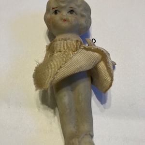 Bisque Frozen Charlotte doll