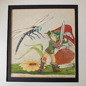 May include: Framed artwork featuring a cartoon illustration of a young figure in green clothing holding a sword, facing a large dragonfly. A mushroom and flower are also depicted. The artwork is signed and dated 4/30/86.