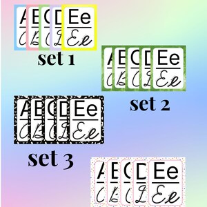 May include: A set of educational alphabet cards titled Manuscript and Cursive Alphabet. The cards display uppercase and lowercase letters in both manuscript and cursive styles. Four distinct sets are shown with different border designs.