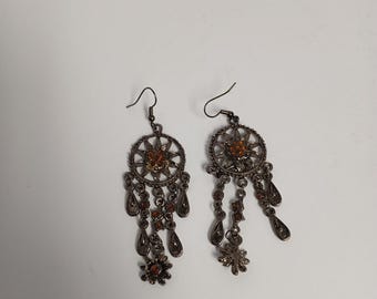 Kevin Jewlers Shepard hook earrings featuring a black plated finish with brown glass chandelier details