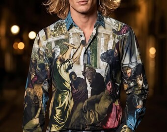 May include: A long-sleeved button-down shirt featuring a detailed, multi-colored Renaissance-style oil painting print. The shirt has a classic collar, dark buttons, and a fitted silhouette, paired with blue denim jeans and a black leather belt.