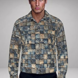 May include: A long-sleeved shirt with a button-down collar, featuring a patchwork design in shades of blue, beige, and brown. The shirt is patterned with square and rectangular shapes. The shirt is worn with black trousers.