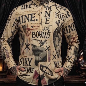 May include: A long-sleeved button-down shirt with a beige background and a collage of black and red graphics, including text, hearts, and stars. The shirt features the words "MINE" and "BOUND".